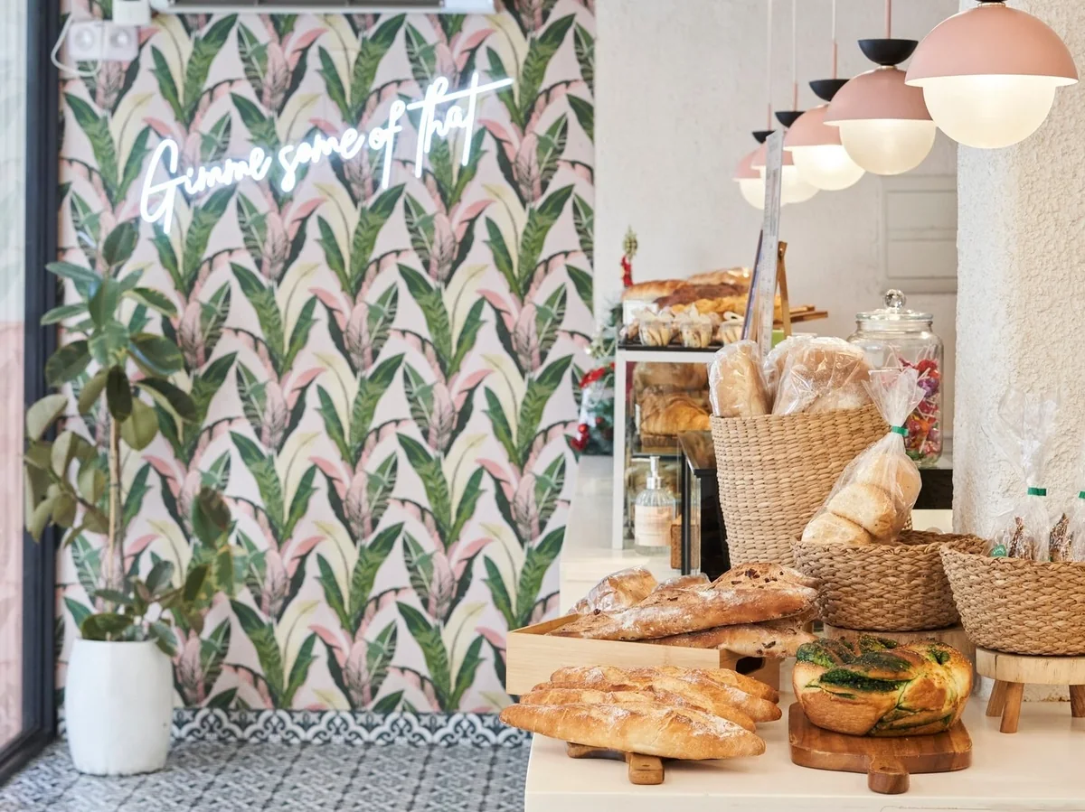 A bright Bramble Bakehouse counter with pastries and cafe seating.